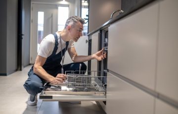 kitchen-facilities-profile-man-touching-details-kitchen-lit-by-daylight_259150-58279